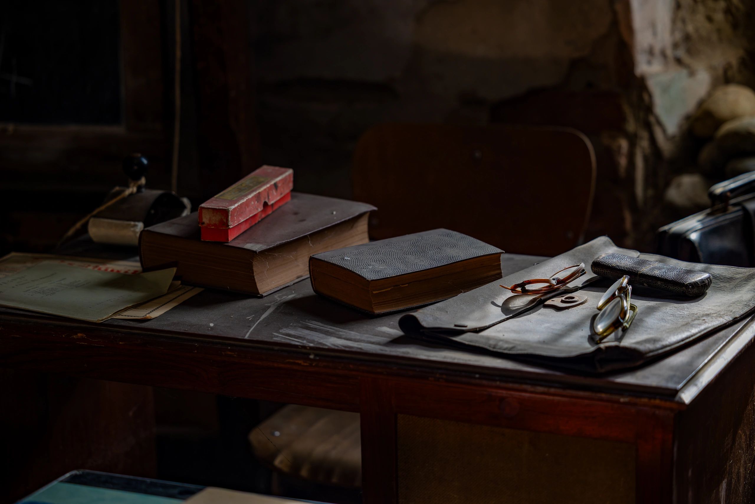 Moody antique desk with old case files and books